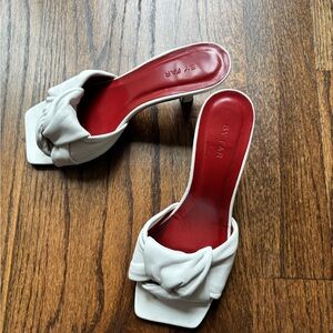 BY FAR White and Red Heeled Mules with Knotted Detail